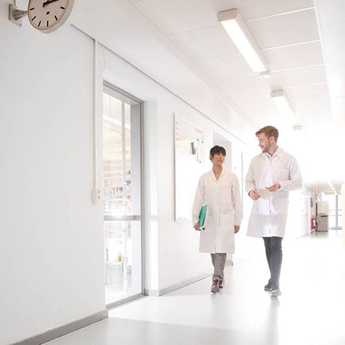 scientists walking in corridor