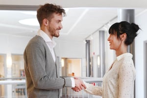 Svar-Life-Science-two-business-people-shaking-hands-after-negotiating-business-in-scandinavian-style-office