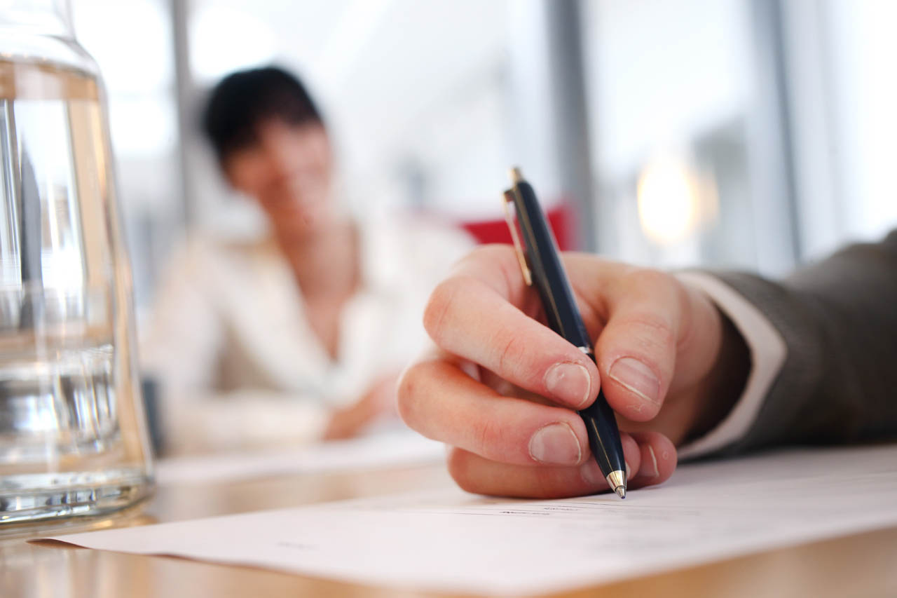 Svar-Life-Science-business-people-signing-partnership-agreement-contract-focus-on-male-hand-putting-signature